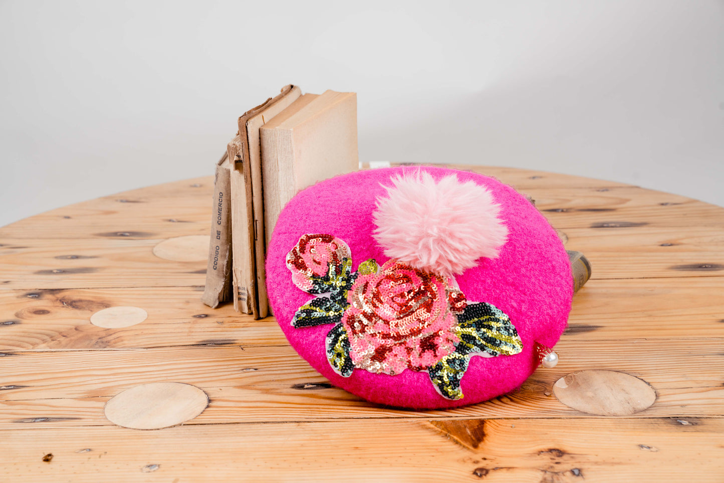 Vibrant Pink Beret with Floral Embellishments and Pom-Pom Accent