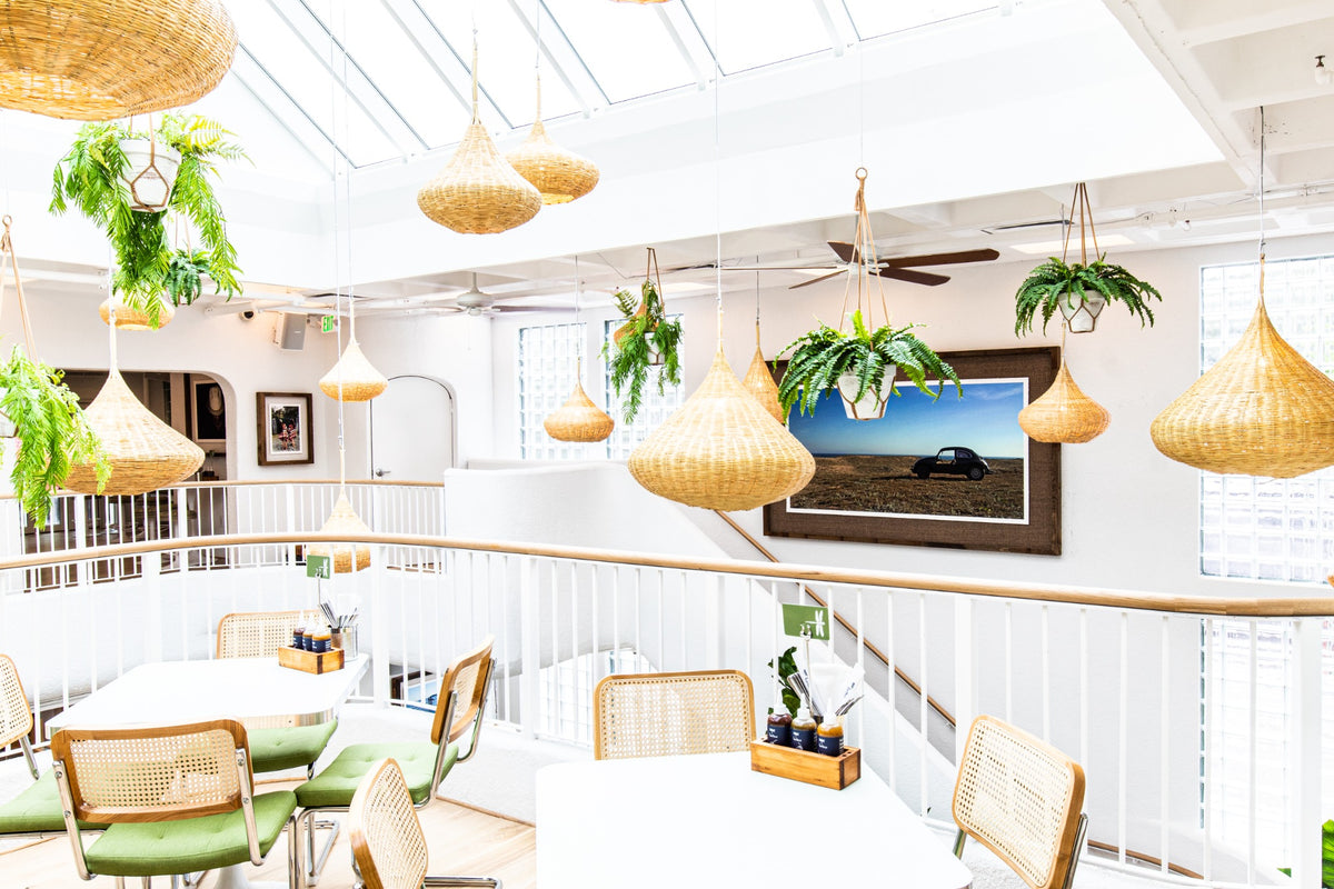 Bright Bartaco interior designed by Genuine & Unique with woven pendant lights and tropical greenery